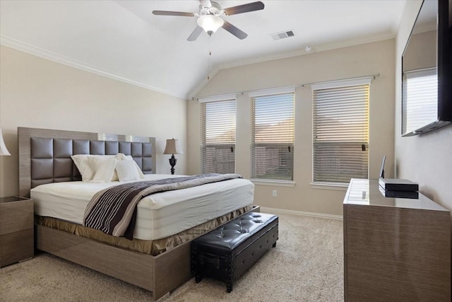 bedroom featuring ceiling fan, crown molding, light carpet, and vaulted ceiling