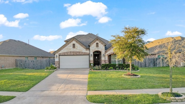 view of front facade with a front lawn and a garage