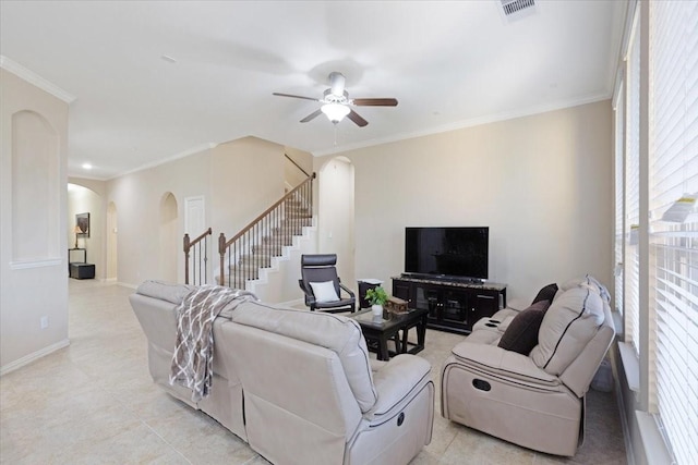 living room featuring ceiling fan and crown molding