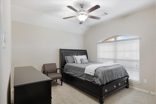 carpeted bedroom with ceiling fan and lofted ceiling