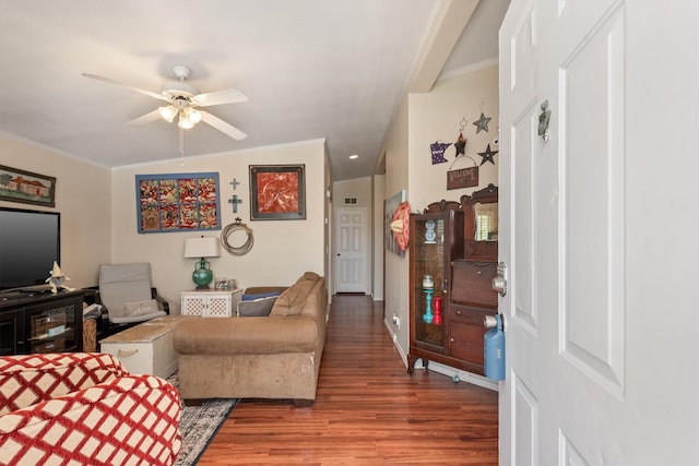 living room featuring ceiling fan, crown molding, wood-type flooring, and lofted ceiling