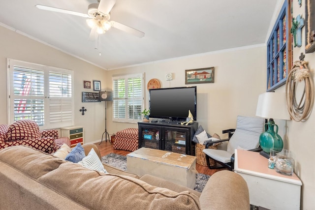 living room featuring hardwood / wood-style floors, lofted ceiling, ceiling fan, and crown molding