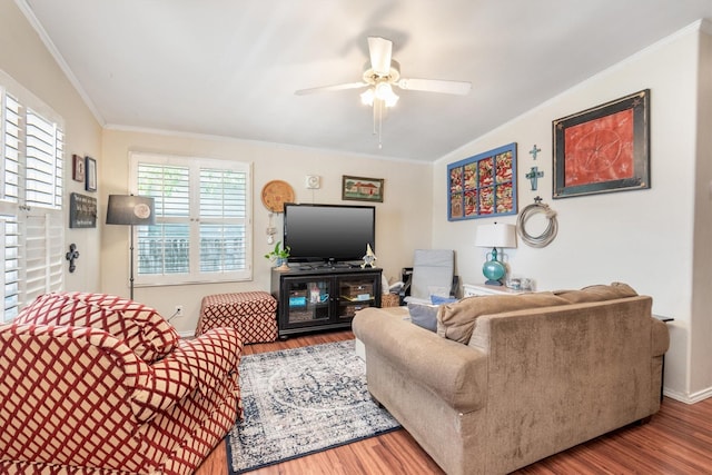 living room with hardwood / wood-style floors, ceiling fan, and crown molding