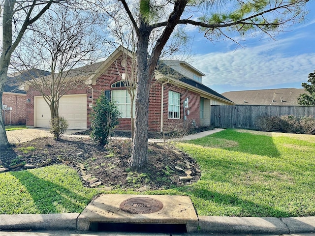 view of property exterior with an outdoor fire pit, an attached garage, fence, a yard, and brick siding