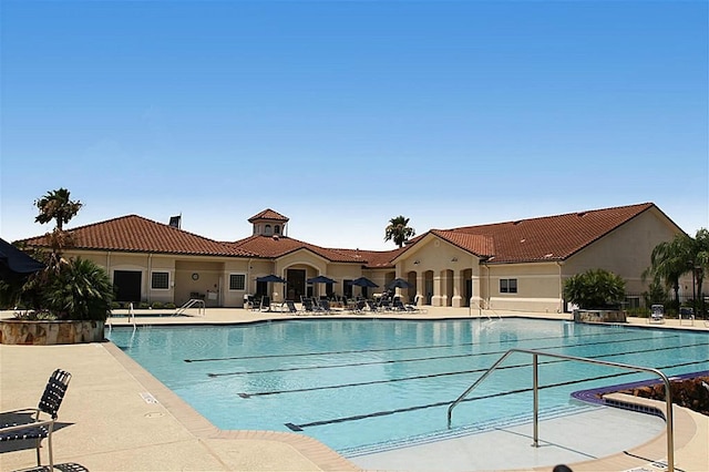 community pool with a patio