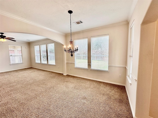 carpeted empty room featuring arched walkways, visible vents, ornamental molding, a textured ceiling, and baseboards