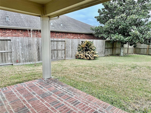 view of yard featuring a patio and fence