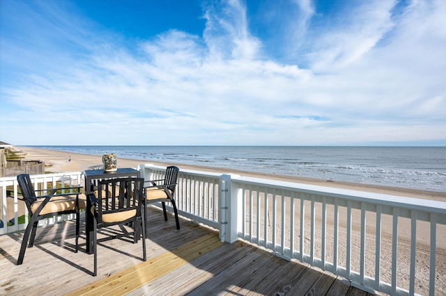 wooden terrace with a water view and a beach view