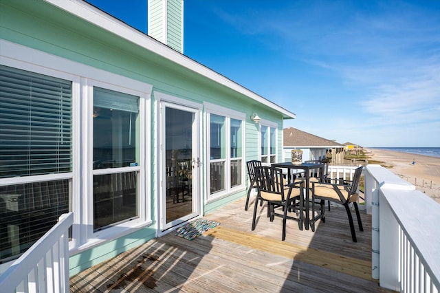 wooden terrace with a water view