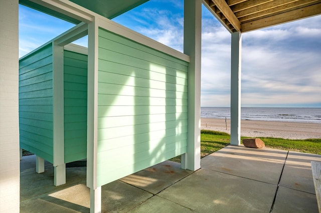 view of outbuilding with a view of the beach and a water view