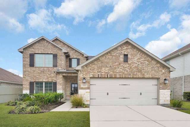 view of front of property with a front lawn and a garage