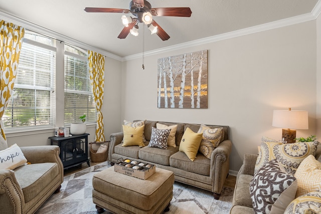 living room featuring ceiling fan and ornamental molding