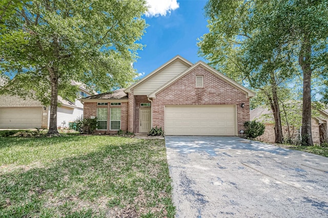 front of property featuring a front yard and a garage