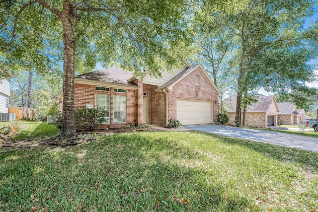 view of front of property featuring cooling unit, a garage, and a front lawn