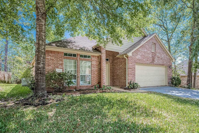 view of front facade with a front yard and a garage