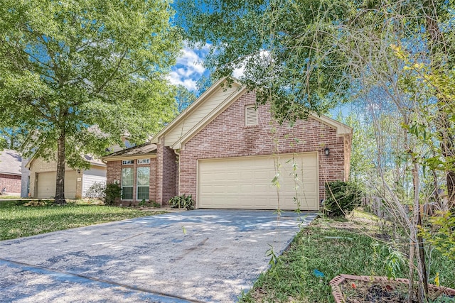 view of property featuring a front yard and a garage