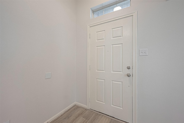 doorway with light hardwood / wood-style floors