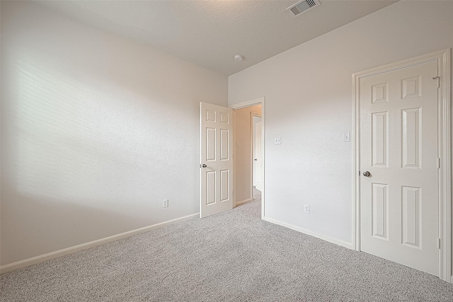 unfurnished bedroom featuring carpet floors