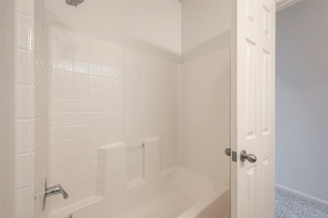 bathroom with washtub / shower combination