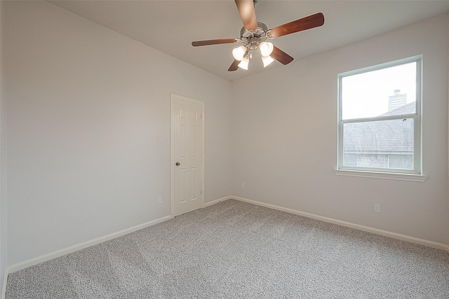 empty room featuring carpet flooring and ceiling fan