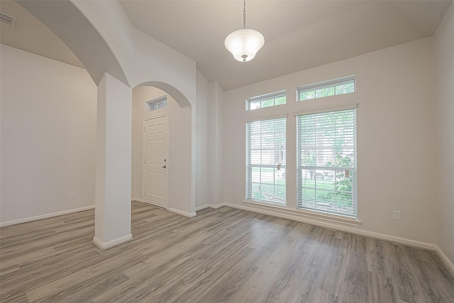 spare room with light hardwood / wood-style flooring