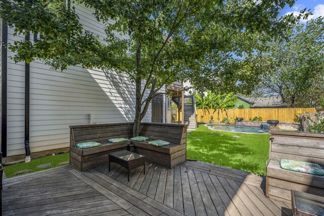 deck featuring a lawn