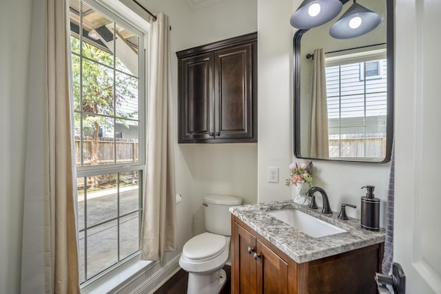 bathroom featuring vanity and toilet