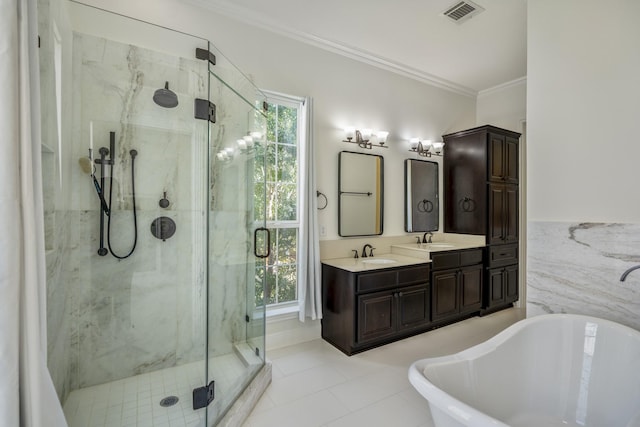 bathroom featuring tile patterned flooring, vanity, crown molding, and independent shower and bath