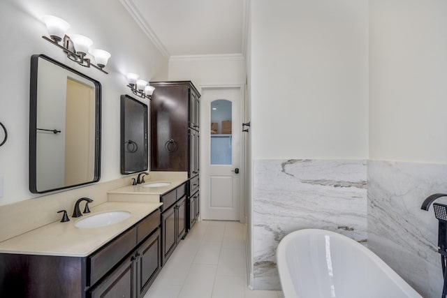 bathroom featuring ornamental molding, vanity, tile walls, tile patterned flooring, and a tub