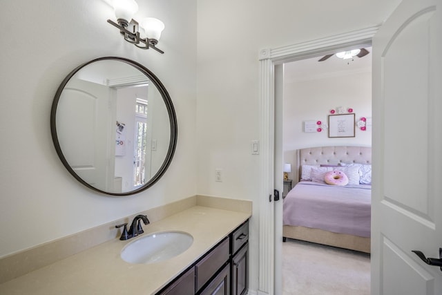 bathroom with ceiling fan and vanity