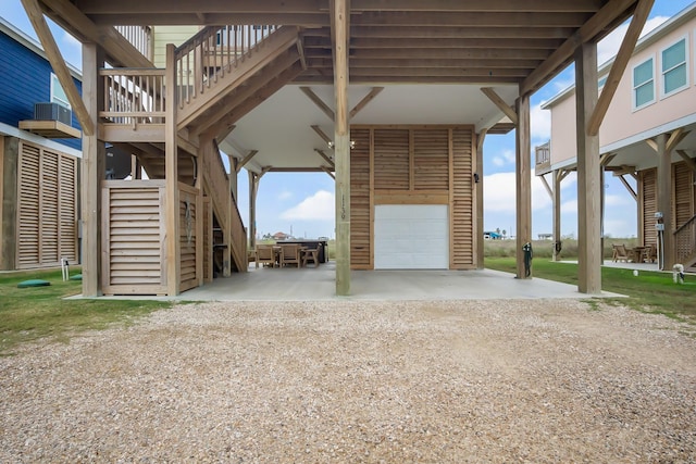 exterior space featuring a carport and a garage