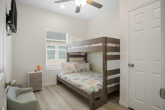 bedroom featuring ceiling fan and light hardwood / wood-style floors