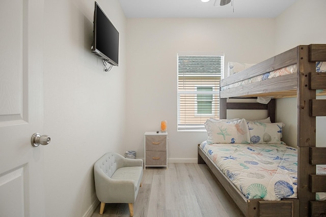 bedroom with ceiling fan and light hardwood / wood-style floors