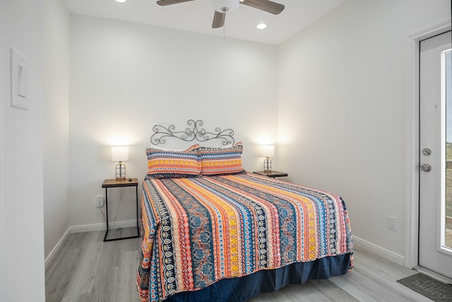 bedroom featuring ceiling fan and light hardwood / wood-style floors