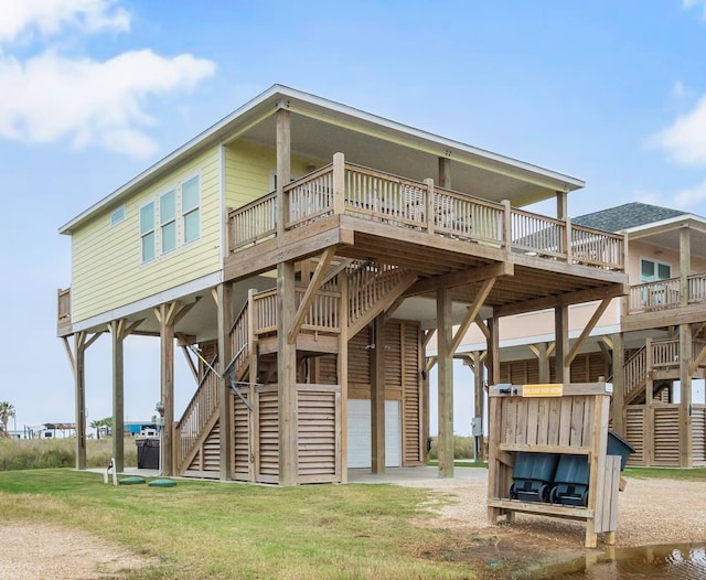 rear view of house featuring a wooden deck