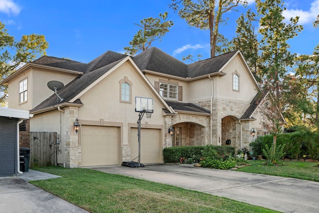 view of front facade featuring a garage and a front lawn