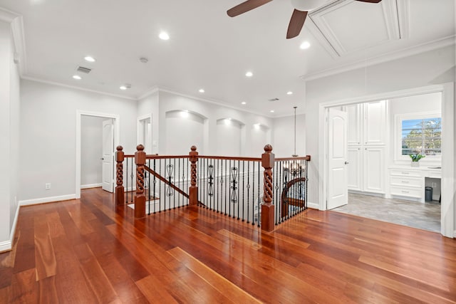 hall featuring hardwood / wood-style floors and ornamental molding