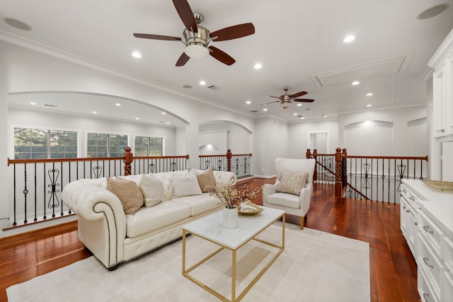 living room featuring ceiling fan, light hardwood / wood-style floors, and ornamental molding