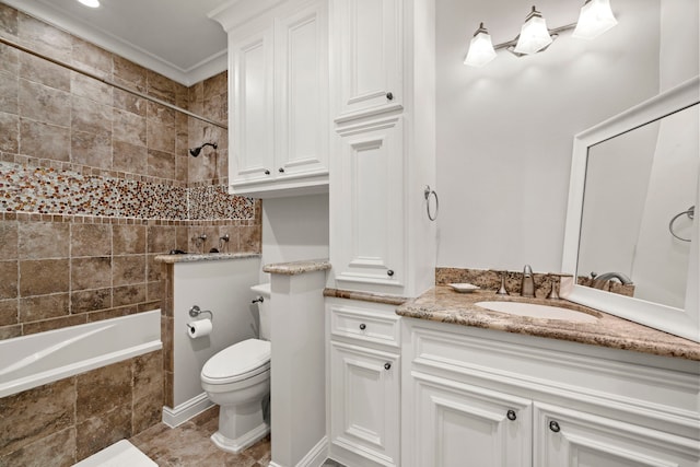 full bathroom with vanity, toilet, and tiled shower / bath