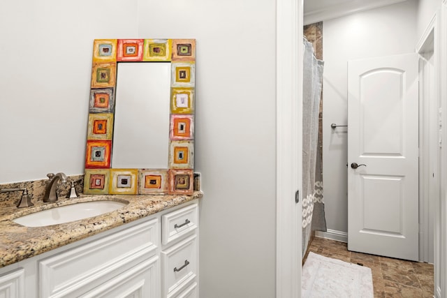 bathroom featuring vanity and ornamental molding