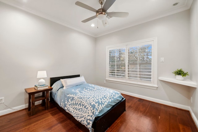 bedroom featuring ceiling fan, dark hardwood / wood-style floors, and ornamental molding