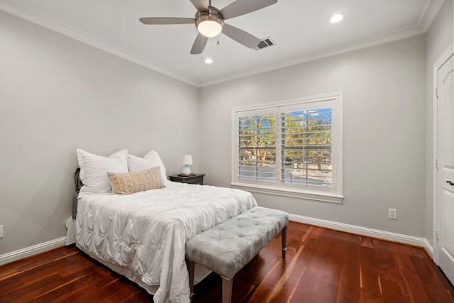 bedroom featuring ceiling fan, dark hardwood / wood-style flooring, and crown molding