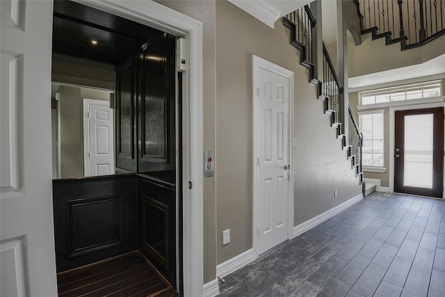 entrance foyer featuring ornamental molding