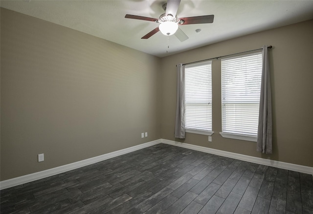 spare room featuring ceiling fan and dark hardwood / wood-style flooring