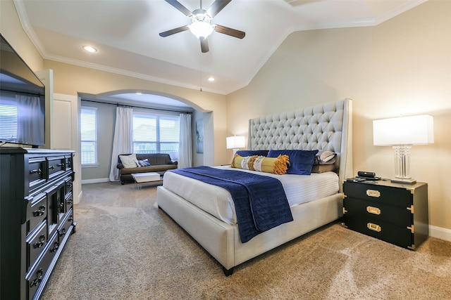 carpeted bedroom with crown molding, ceiling fan, and lofted ceiling