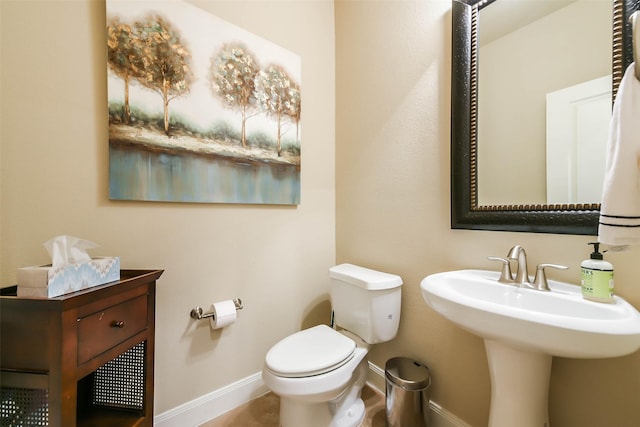 bathroom with toilet and sink