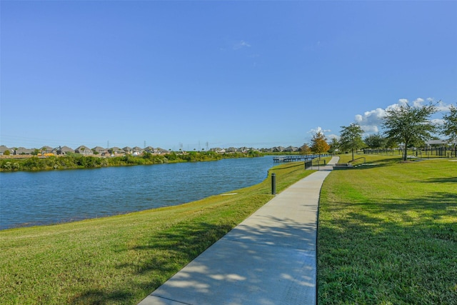 exterior space featuring a yard and a water view