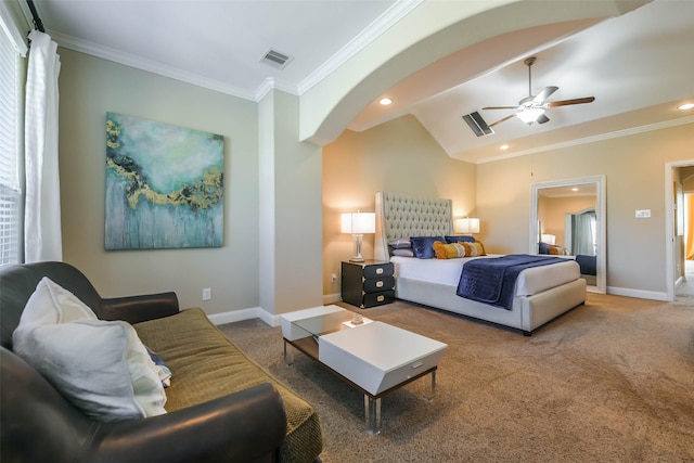 carpeted bedroom with ceiling fan, ornamental molding, and vaulted ceiling