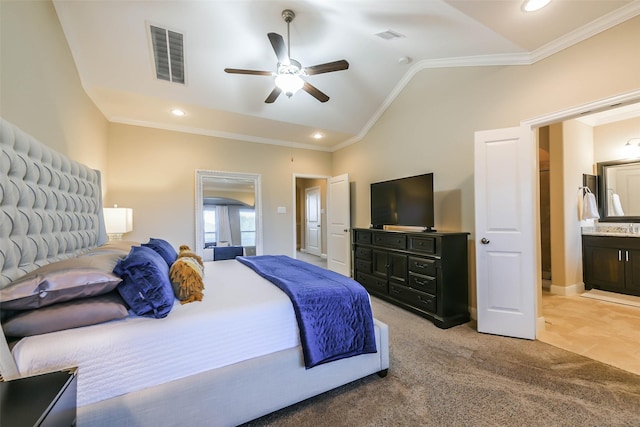 bedroom featuring ensuite bathroom, ornamental molding, light colored carpet, ceiling fan, and lofted ceiling