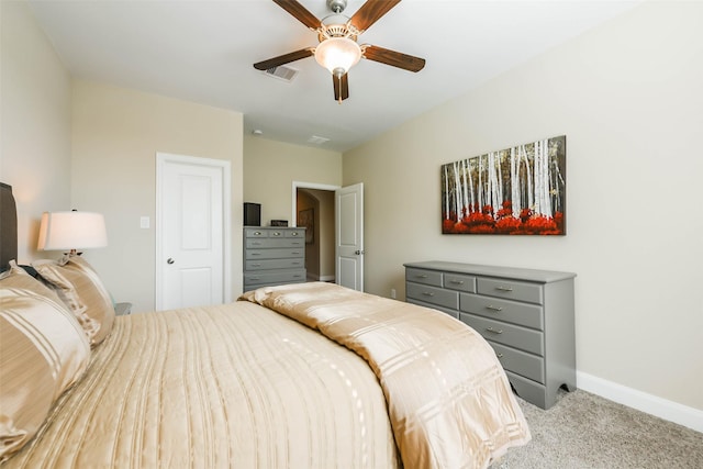 bedroom featuring ceiling fan and light carpet